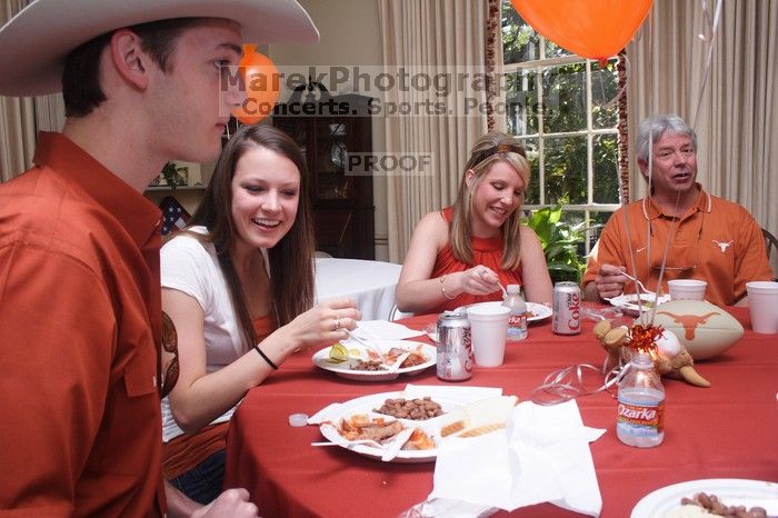 Jill Swanson and her brother, left, with Elizabeth Clinch, right.  Kappa Kappa Gamma (KKG) hosted a parents' weekend barbecue before the UT vs Nebraska football game on Saturday, October 27, 2007 at their sorority house.

Filename: SRM_20071027_1210142.jpg
Aperture: f/8.0
Shutter Speed: 1/250
Body: Canon EOS 20D
Lens: Canon EF-S 18-55mm f/3.5-5.6