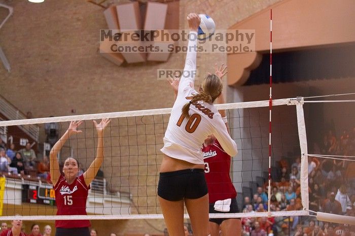 UT sophomore Ashley Engle (#10, S/RS) spikes on Nebraska sophomore Kori Cooper (#15, MB) and Nebraska senior Christina Houghtelling (#3, OH).  The Longhorns defeated the Huskers 3-0 on Wednesday night, October 24, 2007 at Gregory Gym.

Filename: SRM_20071024_1839204.jpg
Aperture: f/3.5
Shutter Speed: 1/400
Body: Canon EOS-1D Mark II
Lens: Canon EF 80-200mm f/2.8 L