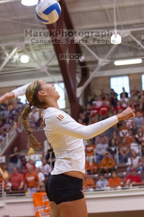 UT sophomore Ashley Engle (#10, S/RS) serves to the Huskers.  The Longhorns defeated the Huskers 3-0 on Wednesday night, October 24, 2007 at Gregory Gym.

Filename: SRM_20071024_1840426.jpg
Aperture: f/4.0
Shutter Speed: 1/400
Body: Canon EOS-1D Mark II
Lens: Canon EF 80-200mm f/2.8 L