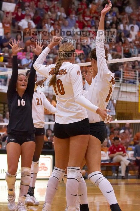 UT sophomore Ashley Engle (#10, S/RS), UT sophomore Destinee Hooker (#21, OH), UT senior Michelle Moriarty (#4, S), UT junior Lauren Paolini (#3, UTIL), and UT senior Alyson Jennings (#16, L) celebrate after a point.  The Longhorns defeated the Huskers 3-0

Filename: SRM_20071024_1841582.jpg
Aperture: f/4.0
Shutter Speed: 1/400
Body: Canon EOS-1D Mark II
Lens: Canon EF 80-200mm f/2.8 L