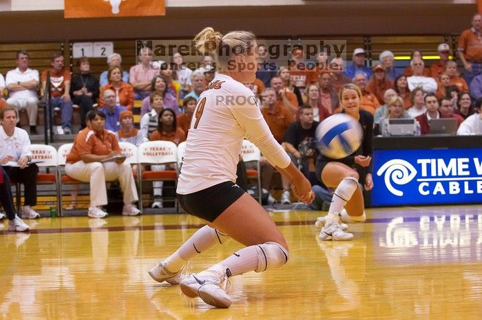 UT sophomore Heather Kisner (#19, DS) hits the ball as UT senior Alyson Jennings (#16, L) watches.  The Longhorns defeated the Huskers 3-0 on Wednesday night, October 24, 2007 at Gregory Gym.

Filename: SRM_20071024_1844166.jpg
Aperture: f/4.0
Shutter Speed: 1/400
Body: Canon EOS-1D Mark II
Lens: Canon EF 80-200mm f/2.8 L