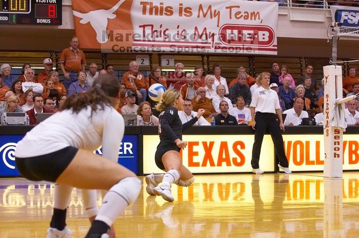 UT senior Alyson Jennings (#16, L) hits the ball wrong as UT freshman Juliann Faucette (#1, OH) watches.  The Longhorns defeated the Huskers 3-0 on Wednesday night, October 24, 2007 at Gregory Gym.

Filename: SRM_20071024_1845045.jpg
Aperture: f/4.0
Shutter Speed: 1/400
Body: Canon EOS-1D Mark II
Lens: Canon EF 80-200mm f/2.8 L