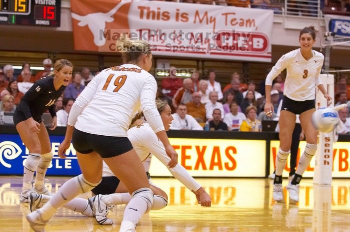 UT sophomore Ashley Engle (#10, S/RS) waits to hit the ball as UT senior Alyson Jennings (#16, L), UT sophomore Heather Kisner (#19, DS), and UT junior Lauren Paolini (#3, UTIL) watch.  The Longhorns defeated the Huskers 3-0 on Wednesday night, October 24,

Filename: SRM_20071024_1852040.jpg
Aperture: f/4.0
Shutter Speed: 1/400
Body: Canon EOS-1D Mark II
Lens: Canon EF 80-200mm f/2.8 L