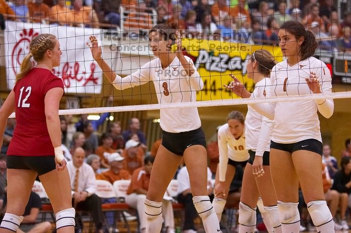 UT junior Lauren Paolini (#3, UTIL), UT senior Michelle Moriarty (#4, S), UT freshman Juliann Faucette (#1, OH), UT sophomore Ashley Engle (#10, S/RS) and Nebraska sophomore Rachel Holloway (#12, S) wait for some more action.  The Longhorns defeated the Hu

Filename: SRM_20071024_1916000.jpg
Aperture: f/3.5
Shutter Speed: 1/400
Body: Canon EOS-1D Mark II
Lens: Canon EF 80-200mm f/2.8 L