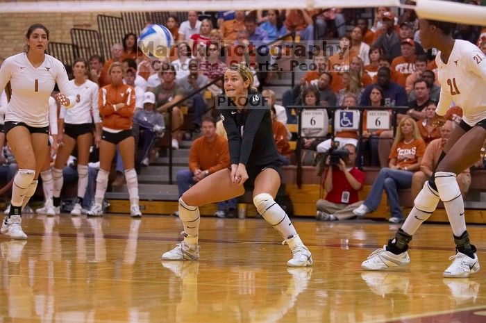 UT senior Alyson Jennings (#16, L) hits the ball as UT sophomore Destinee Hooker (#21, OH) and UT freshman Juliann Faucette (#1, OH) watch.  The Longhorns defeated the Huskers 3-0 on Wednesday night, October 24, 2007 at Gregory Gym.

Filename: SRM_20071024_1919525.jpg
Aperture: f/4.0
Shutter Speed: 1/400
Body: Canon EOS-1D Mark II
Lens: Canon EF 80-200mm f/2.8 L