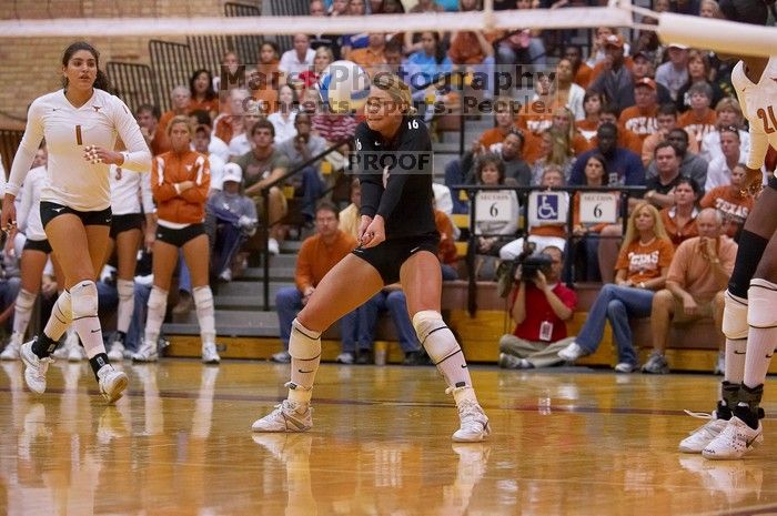 UT senior Alyson Jennings (#16, L) hits the ball as UT sophomore Destinee Hooker (#21, OH) and UT freshman Juliann Faucette (#1, OH) watch.  The Longhorns defeated the Huskers 3-0 on Wednesday night, October 24, 2007 at Gregory Gym.

Filename: SRM_20071024_1919546.jpg
Aperture: f/4.0
Shutter Speed: 1/400
Body: Canon EOS-1D Mark II
Lens: Canon EF 80-200mm f/2.8 L