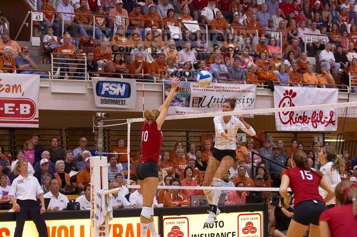 UT junior Lauren Paolini (#3, UTIL) spikes the ball as Nebraska junior Jordan Larson (#10, OH) attempts to block it and Nebraska sophomore Kori Cooper (#15, MB) watches.  The Longhorns defeated the Huskers 3-0 on Wednesday night, October 24, 2007 at Gregor

Filename: SRM_20071024_1924384.jpg
Aperture: f/4.0
Shutter Speed: 1/400
Body: Canon EOS-1D Mark II
Lens: Canon EF 80-200mm f/2.8 L