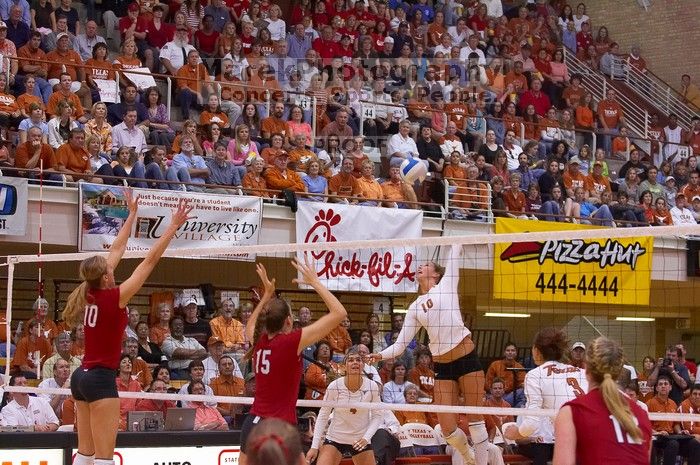 UT sophomore Ashley Engle (#10, S/RS) spikes the ball as Nebraska junior Jordan Larson (#10, OH) and Nebraska sophomore Kori Cooper (#15, MB) attempt to block it, and UT senior Michelle Moriarty (#4, S), UT junior Lauren Paolini (#3, UTIL) and Nebraska sop

Filename: SRM_20071024_1924468.jpg
Aperture: f/4.0
Shutter Speed: 1/400
Body: Canon EOS-1D Mark II
Lens: Canon EF 80-200mm f/2.8 L