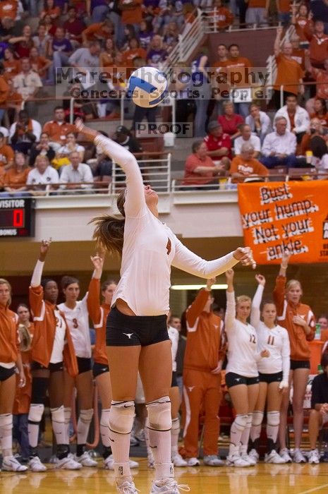 UT senior Michelle Moriarty (#4, S) serves the ball.  The Longhorns defeated the Huskers 3-0 on Wednesday night, October 24, 2007 at Gregory Gym.

Filename: SRM_20071024_1949009.jpg
Aperture: f/4.0
Shutter Speed: 1/320
Body: Canon EOS-1D Mark II
Lens: Canon EF 80-200mm f/2.8 L