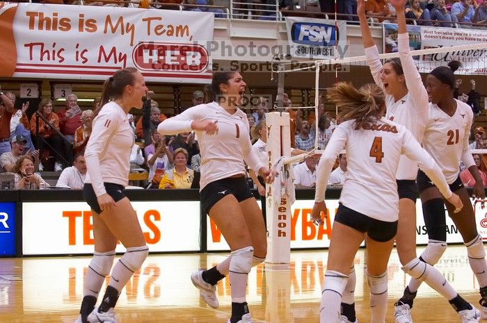 UT junior Kiley Hall (#11, DS/L), UT freshman Juliann Faucette (#1, OH), UT senior Michelle Moriarty (#4, S), UT junior Lauren Paolini (#3, UTIL) and UT sophomore Destinee Hooker (#21, OH) are ecstatic after a point.  The Longhorns defeated the Huskers 3-0

Filename: SRM_20071024_1954542.jpg
Aperture: f/4.0
Shutter Speed: 1/400
Body: Canon EOS-1D Mark II
Lens: Canon EF 80-200mm f/2.8 L