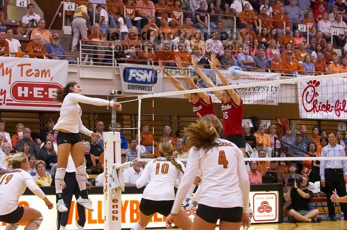 UT freshman Juliann Faucette (#1, OH) hits the ball past blockers Nebraska senior Sarah Pavan (#9, RS) and Nebraska sophomore Kori Cooper (#15, MB) as UT sophomore Heather Kisner (#19, DS), UT sophomore Ashley Engle (#10, S/RS) and UT senior Michelle Moria

Filename: SRM_20071024_2004220.jpg
Aperture: f/4.0
Shutter Speed: 1/320
Body: Canon EOS-1D Mark II
Lens: Canon EF 80-200mm f/2.8 L