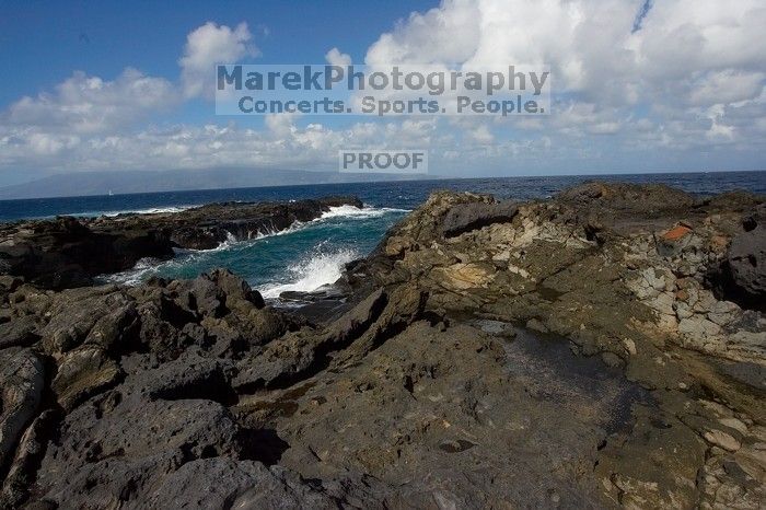 Hike to the Nakalele blowholes along the surf-beaten lava formations.

Filename: SRM_20071219_1229073.jpg
Aperture: f/8.0
Shutter Speed: 1/5000
Body: Canon EOS-1D Mark II
Lens: Sigma 15-30mm f/3.5-4.5 EX Aspherical DG DF