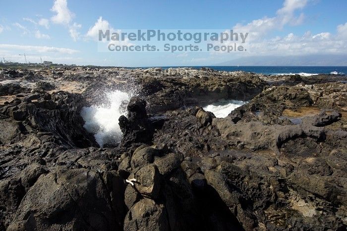 Hike to the Nakalele blowholes along the surf-beaten lava formations.

Filename: SRM_20071219_1229572.jpg
Aperture: f/8.0
Shutter Speed: 1/2500
Body: Canon EOS-1D Mark II
Lens: Sigma 15-30mm f/3.5-4.5 EX Aspherical DG DF