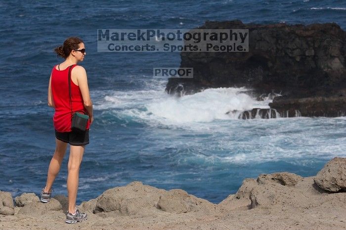 Carolyn Bayer.  Hike to the Nakalele blowholes along the surf-beaten lava formations.

Filename: SRM_20071219_1333377.jpg
Aperture: f/8.0
Shutter Speed: 1/1250
Body: Canon EOS 20D
Lens: Canon EF 80-200mm f/2.8 L