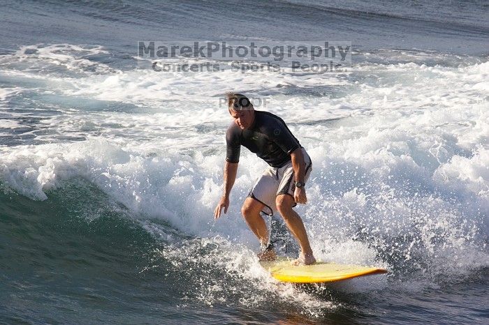 Surfers in Honolua Bay, Maui, Hawai'i, 2007.

Filename: SRM_20071217_1623540.jpg
Aperture: f/5.6
Shutter Speed: 1/2000
Body: Canon EOS 20D
Lens: Canon EF 300mm f/2.8 L IS