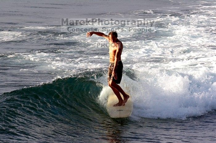 Surfers in Honolua Bay, Maui, Hawai'i, 2007.

Filename: SRM_20071217_1628238.jpg
Aperture: f/8.0
Shutter Speed: 1/1000
Body: Canon EOS 20D
Lens: Canon EF 300mm f/2.8 L IS