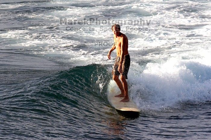 Surfers in Honolua Bay, Maui, Hawai'i, 2007.

Filename: SRM_20071217_1628249.jpg
Aperture: f/8.0
Shutter Speed: 1/1000
Body: Canon EOS 20D
Lens: Canon EF 300mm f/2.8 L IS