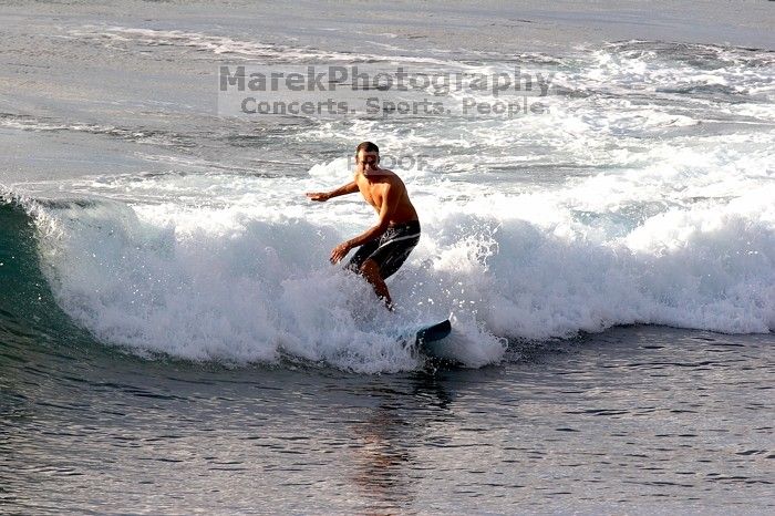 Surfers in Honolua Bay, Maui, Hawai'i, 2007.

Filename: SRM_20071217_1631399.jpg
Aperture: f/8.0
Shutter Speed: 1/1000
Body: Canon EOS 20D
Lens: Canon EF 300mm f/2.8 L IS