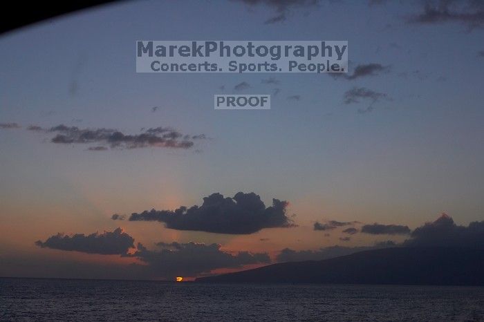 Sunset over the island of Lanai in Lahaina, Maui, Hawai'i, 2007.

Filename: SRM_20071219_1747483.jpg
Aperture: f/8.0
Shutter Speed: 1/320
Body: Canon EOS-1D Mark II
Lens: Canon EF 50mm f/1.8 II