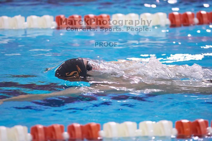 UT senior Daniel Rohleder took first in the 100 yard backstroke with a time of 9:11.44.  The University of Texas Longhorns defeated The University of Georgia Bulldogs 157-135 on Saturday, January 12, 2008.

Filename: SRM_20080112_1122424.jpg
Aperture: f/2.8
Shutter Speed: 1/400
Body: Canon EOS-1D Mark II
Lens: Canon EF 300mm f/2.8 L IS