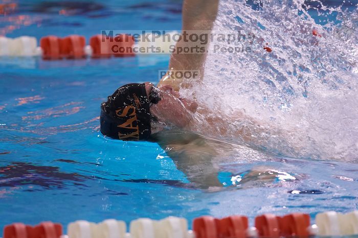 UT senior Daniel Rohleder took first in the 100 yard backstroke with a time of 9:11.44.  The University of Texas Longhorns defeated The University of Georgia Bulldogs 157-135 on Saturday, January 12, 2008.

Filename: SRM_20080112_1122446.jpg
Aperture: f/2.8
Shutter Speed: 1/400
Body: Canon EOS-1D Mark II
Lens: Canon EF 300mm f/2.8 L IS