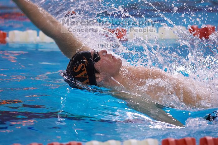 UT senior Daniel Rohleder took first in the 100 yard backstroke with a time of 9:11.44.  The University of Texas Longhorns defeated The University of Georgia Bulldogs 157-135 on Saturday, January 12, 2008.

Filename: SRM_20080112_1122467.jpg
Aperture: f/2.8
Shutter Speed: 1/400
Body: Canon EOS-1D Mark II
Lens: Canon EF 300mm f/2.8 L IS