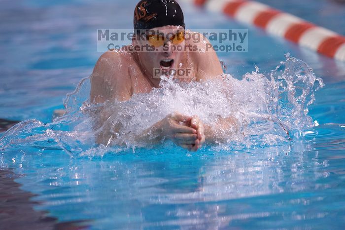 UT senior Agustin Magruder took second in the 100 yard breaststroke with a time of 56.67.  The University of Texas Longhorns defeated The University of Georgia Bulldogs 157-135 on Saturday, January 12, 2008.

Filename: SRM_20080112_1124287.jpg
Aperture: f/2.8
Shutter Speed: 1/400
Body: Canon EOS-1D Mark II
Lens: Canon EF 300mm f/2.8 L IS