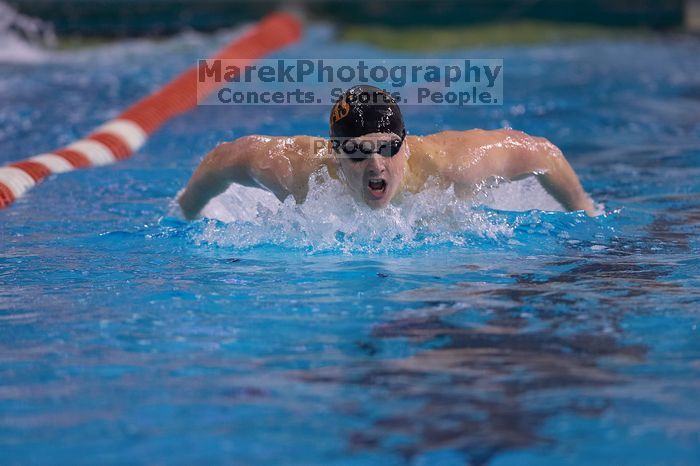 UT senior Christopher Seitz took second in the 200 yard butterfly with a time of 1:49.57.  The University of Texas Longhorns defeated The University of Georgia Bulldogs 157-135 on Saturday, January 12, 2008.

Filename: SRM_20080112_1127442.jpg
Aperture: f/2.8
Shutter Speed: 1/400
Body: Canon EOS-1D Mark II
Lens: Canon EF 300mm f/2.8 L IS