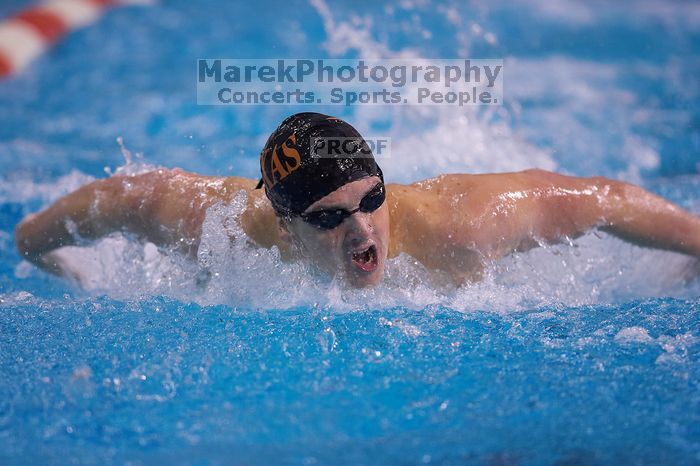 UT senior Christopher Seitz took second in the 200 yard butterfly with a time of 1:49.57.  The University of Texas Longhorns defeated The University of Georgia Bulldogs 157-135 on Saturday, January 12, 2008.

Filename: SRM_20080112_1127543.jpg
Aperture: f/2.8
Shutter Speed: 1/400
Body: Canon EOS-1D Mark II
Lens: Canon EF 300mm f/2.8 L IS