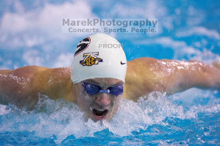 Georgia's Gil Stovall took first in the 200 yard butterfly with a time of 1:47.32.  The University of Texas Longhorns defeated The University of Georgia Bulldogs 157-135 on Saturday, January 12, 2008.

Filename: SRM_20080112_1127586.jpg
Aperture: f/2.8
Shutter Speed: 1/400
Body: Canon EOS-1D Mark II
Lens: Canon EF 300mm f/2.8 L IS