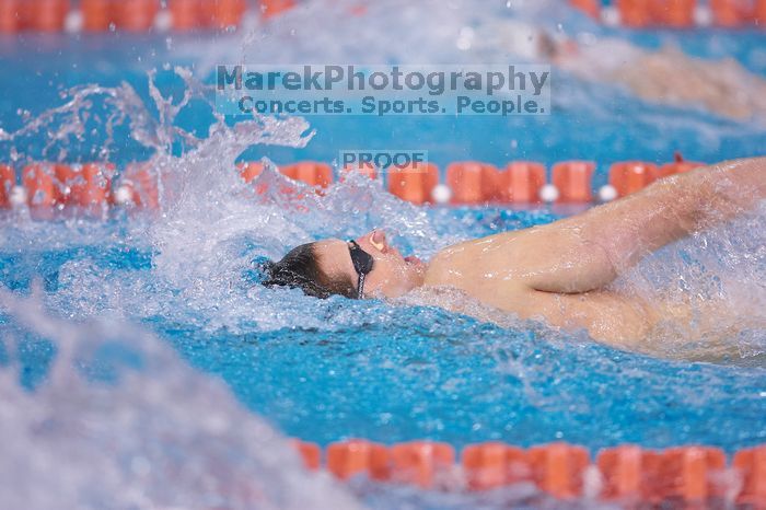 UT junior Michael Klueh took second in the 200 yard backstrong with a time of 1:50.70.  The University of Texas Longhorns defeated The University of Georgia Bulldogs 157-135 on Saturday, January 12, 2008.

Filename: SRM_20080112_1157460.jpg
Aperture: f/2.8
Shutter Speed: 1/400
Body: Canon EOS-1D Mark II
Lens: Canon EF 300mm f/2.8 L IS