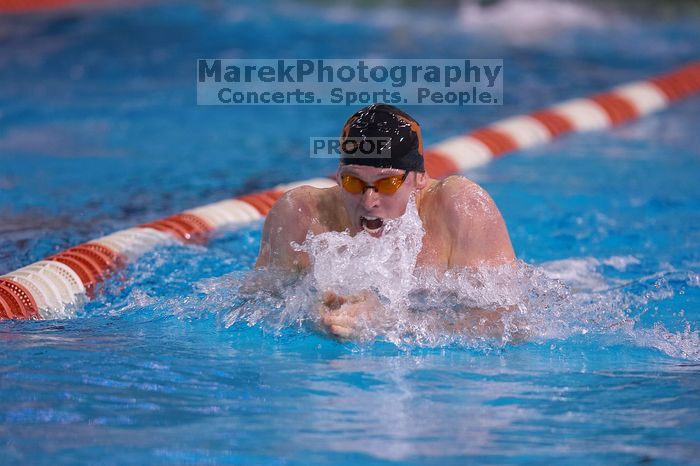 UT senior Matthew Lowe took first in the 200 yard breaststroke with a time of 2:01.46.  The University of Texas Longhorns defeated The University of Georgia Bulldogs 157-135 on Saturday, January 12, 2008.

Filename: SRM_20080112_1201566.jpg
Aperture: f/2.8
Shutter Speed: 1/400
Body: Canon EOS-1D Mark II
Lens: Canon EF 300mm f/2.8 L IS