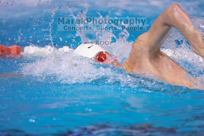 Georgia's Sebastien Rouault took second in the 500 yard freestyle with a time of 4:29.17.  The University of Texas Longhorns defeated The University of Georgia Bulldogs 157-135 on Saturday, January 12, 2008.

Filename: SRM_20080112_1205024.jpg
Aperture: f/2.8
Shutter Speed: 1/400
Body: Canon EOS-1D Mark II
Lens: Canon EF 300mm f/2.8 L IS