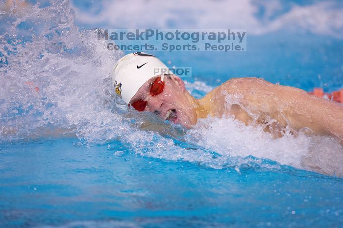 Georgia's Sebastien Rouault took second in the 500 yard freestyle with a time of 4:29.17.  The University of Texas Longhorns defeated The University of Georgia Bulldogs 157-135 on Saturday, January 12, 2008.

Filename: SRM_20080112_1207585.jpg
Aperture: f/2.8
Shutter Speed: 1/400
Body: Canon EOS-1D Mark II
Lens: Canon EF 300mm f/2.8 L IS