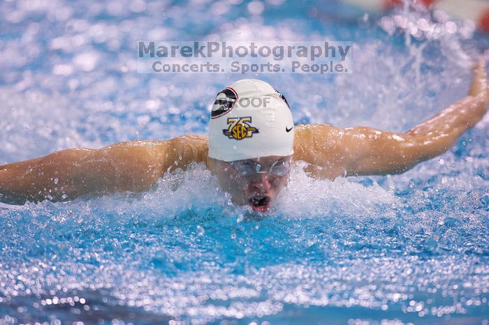 Georgia's James Lavender, the 100 yard breaststroke with a time of 53.02.  The University of Texas Longhorns defeated The University of Georgia Bulldogs 157-135 on Saturday, January 12, 2008.

Filename: SRM_20080112_1210220.jpg
Aperture: f/2.8
Shutter Speed: 1/400
Body: Canon EOS-1D Mark II
Lens: Canon EF 300mm f/2.8 L IS