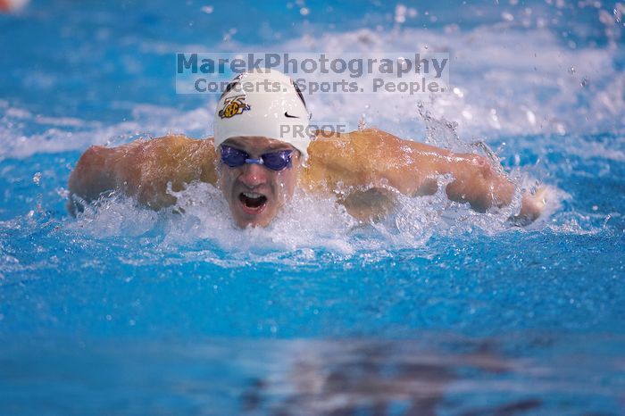 Georgia's Gil Stovall took first in the 100 yard butterfly with a time of 49.01.  The University of Texas Longhorns defeated The University of Georgia Bulldogs 157-135 on Saturday, January 12, 2008.

Filename: SRM_20080112_1212024.jpg
Aperture: f/2.8
Shutter Speed: 1/400
Body: Canon EOS-1D Mark II
Lens: Canon EF 300mm f/2.8 L IS