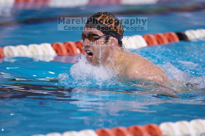 UT sophomore Trey Hoover competed in the 400 yard IM with a time of 4:10.06.  The University of Texas Longhorns defeated The University of Georgia Bulldogs 157-135 on Saturday, January 12, 2008.

Filename: SRM_20080112_1240328.jpg
Aperture: f/2.8
Shutter Speed: 1/400
Body: Canon EOS-1D Mark II
Lens: Canon EF 300mm f/2.8 L IS