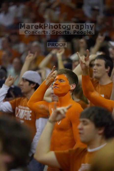 Dane Ehlert shows his school spirit before the Kansas basketball game.  The University of Texas (UT) Longhorns defeated the University of Kansas Jayhawks 72-69 in Austin, Texas on Monday, February 11, 2008.

Filename: SRM_20080211_2002445.jpg
Aperture: f/2.8
Shutter Speed: 1/640
Body: Canon EOS-1D Mark II
Lens: Canon EF 80-200mm f/2.8 L