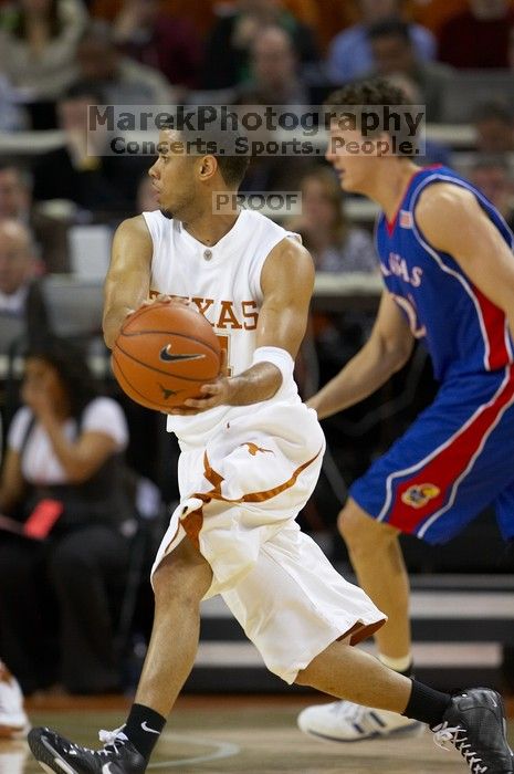 UT junior A.J. Abrams (#3, G) playing defense against a Kansas player.  The University of Texas (UT) Longhorns defeated the University of Kansas Jayhawks 72-69 in Austin, Texas on Monday, February 11, 2008.

Filename: SRM_20080211_2022009.jpg
Aperture: f/3.2
Shutter Speed: 1/640
Body: Canon EOS 20D
Lens: Canon EF 300mm f/2.8 L IS