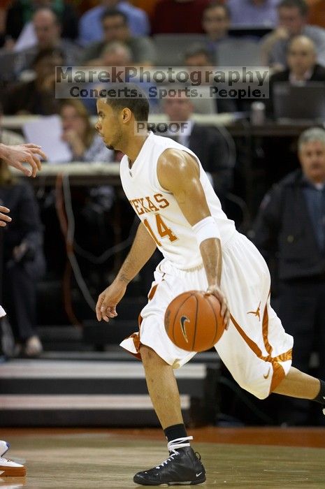 UT junior A.J. Abrams (#3, G) playing defense against a Kansas player.  The University of Texas (UT) Longhorns defeated the University of Kansas Jayhawks 72-69 in Austin, Texas on Monday, February 11, 2008.

Filename: SRM_20080211_2035564.jpg
Aperture: f/2.8
Shutter Speed: 1/640
Body: Canon EOS 20D
Lens: Canon EF 300mm f/2.8 L IS