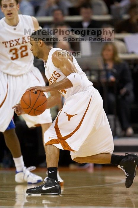 UT junior A.J. Abrams (#3, G) playing defense against a Kansas player.  The University of Texas (UT) Longhorns defeated the University of Kansas Jayhawks 72-69 in Austin, Texas on Monday, February 11, 2008.

Filename: SRM_20080211_2035586.jpg
Aperture: f/2.8
Shutter Speed: 1/640
Body: Canon EOS 20D
Lens: Canon EF 300mm f/2.8 L IS