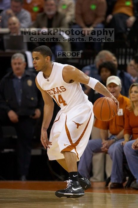 UT junior A.J. Abrams (#3, G) playing defense against a Kansas player.  The University of Texas (UT) Longhorns defeated the University of Kansas Jayhawks 72-69 in Austin, Texas on Monday, February 11, 2008.

Filename: SRM_20080211_2036300.jpg
Aperture: f/2.8
Shutter Speed: 1/640
Body: Canon EOS 20D
Lens: Canon EF 300mm f/2.8 L IS