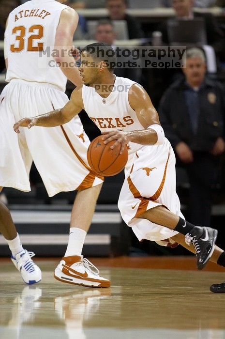 UT junior A.J. Abrams (#3, G) playing defense against a Kansas player.  The University of Texas (UT) Longhorns defeated the University of Kansas Jayhawks 72-69 in Austin, Texas on Monday, February 11, 2008.

Filename: SRM_20080211_2036363.jpg
Aperture: f/2.8
Shutter Speed: 1/640
Body: Canon EOS 20D
Lens: Canon EF 300mm f/2.8 L IS