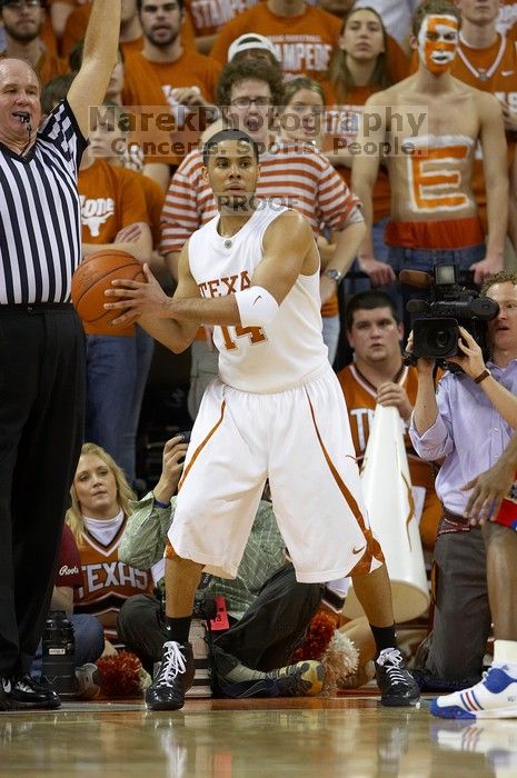 UT junior A.J. Abrams (#3, G) playing defense against a Kansas player.  The University of Texas (UT) Longhorns defeated the University of Kansas Jayhawks 72-69 in Austin, Texas on Monday, February 11, 2008.

Filename: SRM_20080211_2041563.jpg
Aperture: f/2.8
Shutter Speed: 1/640
Body: Canon EOS 20D
Lens: Canon EF 300mm f/2.8 L IS