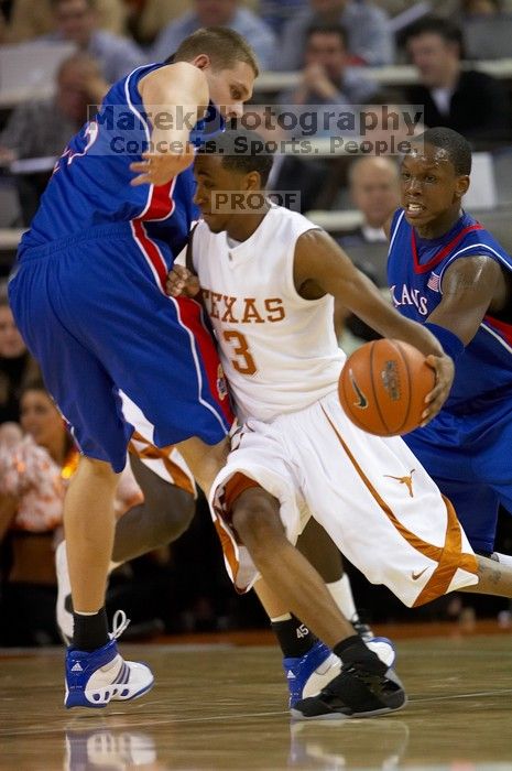 The University of Texas (UT) Longhorns defeated the University of Kansas Jayhawks 72-69 in Austin, Texas on Monday, February 11, 2008.

Filename: SRM_20080211_2043124.jpg
Aperture: f/2.8
Shutter Speed: 1/640
Body: Canon EOS 20D
Lens: Canon EF 300mm f/2.8 L IS