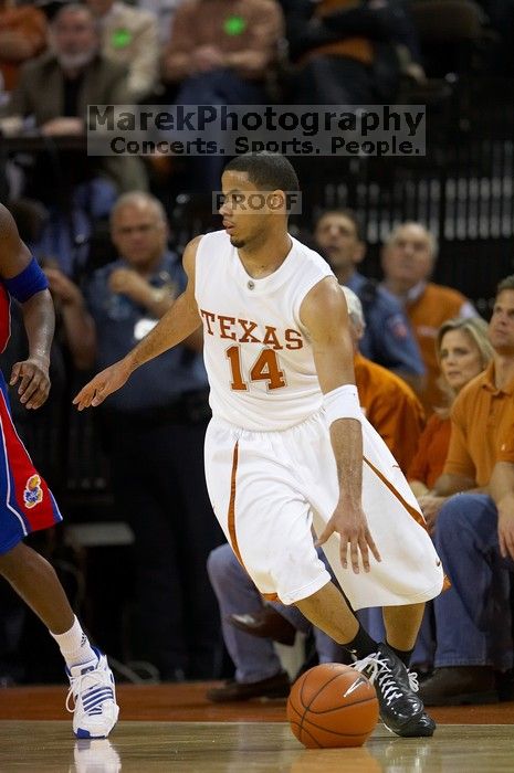 UT junior A.J. Abrams (#3, G) playing defense against a Kansas player.  The University of Texas (UT) Longhorns defeated the University of Kansas Jayhawks 72-69 in Austin, Texas on Monday, February 11, 2008.

Filename: SRM_20080211_2045169.jpg
Aperture: f/2.8
Shutter Speed: 1/640
Body: Canon EOS 20D
Lens: Canon EF 300mm f/2.8 L IS