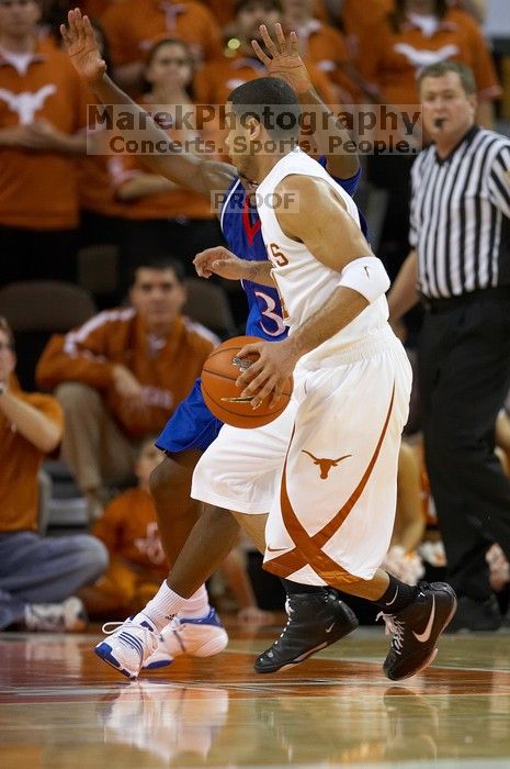 UT junior A.J. Abrams (#3, G) playing defense against a Kansas player.  The University of Texas (UT) Longhorns defeated the University of Kansas Jayhawks 72-69 in Austin, Texas on Monday, February 11, 2008.

Filename: SRM_20080211_2045180.jpg
Aperture: f/2.8
Shutter Speed: 1/640
Body: Canon EOS 20D
Lens: Canon EF 300mm f/2.8 L IS