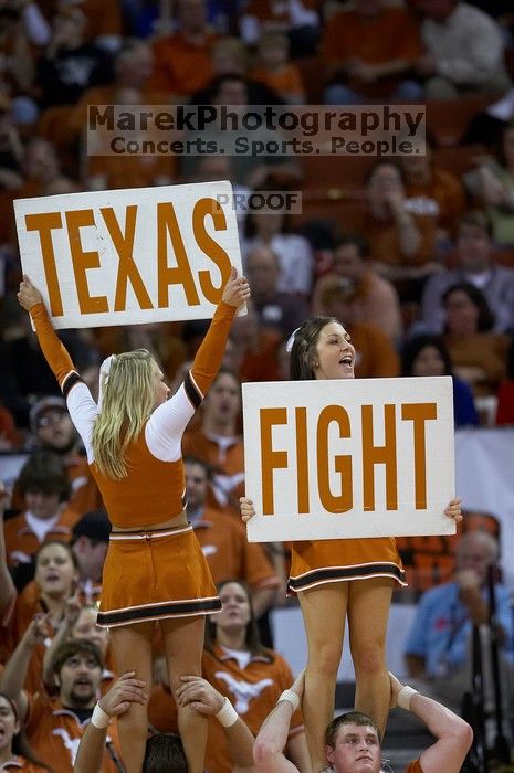 UT Cheerleaders rallying the fans at the Kansas game.  The University of Texas (UT) Longhorns defeated the University of Kansas Jayhawks 72-69 in Austin, Texas on Monday, February 11, 2008.

Filename: SRM_20080211_2052124.jpg
Aperture: f/2.8
Shutter Speed: 1/640
Body: Canon EOS 20D
Lens: Canon EF 300mm f/2.8 L IS