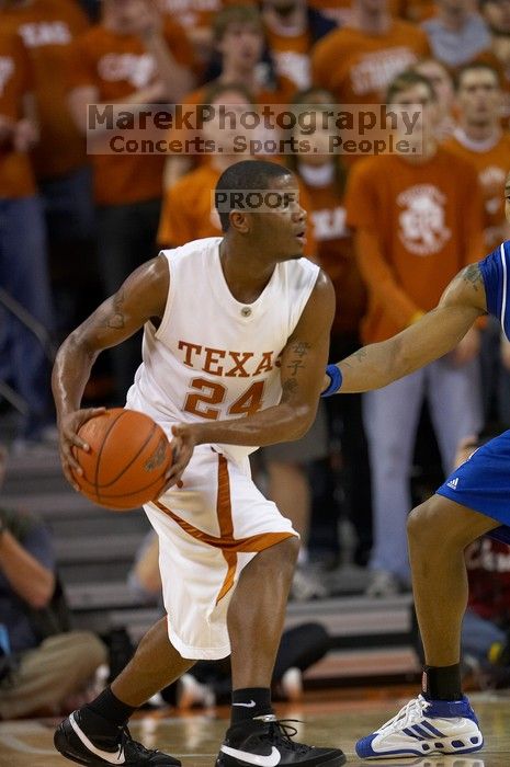 UT sophomore Justin Mason (#24, G).  The University of Texas (UT) Longhorns defeated the University of Kansas Jayhawks 72-69 in Austin, Texas on Monday, February 11, 2008.

Filename: SRM_20080211_2052582.jpg
Aperture: f/2.8
Shutter Speed: 1/640
Body: Canon EOS 20D
Lens: Canon EF 300mm f/2.8 L IS