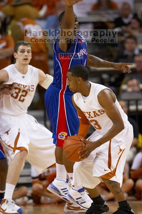 UT junior A.J. Abrams (#3, G).  The University of Texas (UT) Longhorns defeated the University of Kansas Jayhawks 72-69 in Austin, Texas on Monday, February 11, 2008.

Filename: SRM_20080211_2053045.jpg
Aperture: f/2.8
Shutter Speed: 1/640
Body: Canon EOS 20D
Lens: Canon EF 300mm f/2.8 L IS